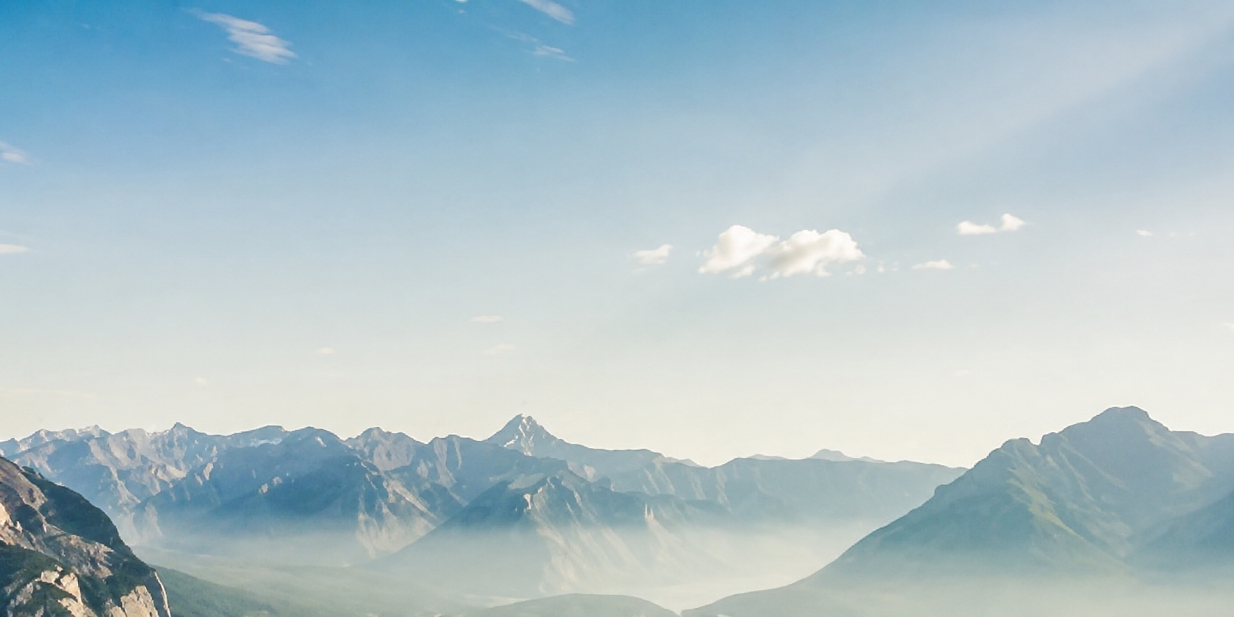 Calm mountain horizon at sunrise representing a fresh financial start